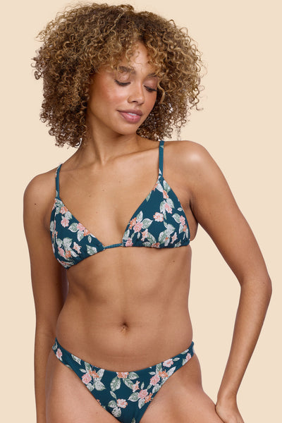 Female model wearing the Women's Margie Bikini Top in the Islander Ribbed print, standing in front of a yellow background, shown from the front view

|| Size S, Bust 32.5"  