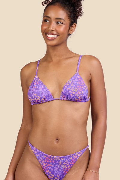 Female model wearing the Women's Margie Bikini Top in the Jellybean print, standing in front of a yellow background shown from the front view

|| Size S, Bust 32"