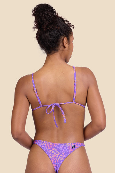 Female model wearing the Women's Margie Bikini Top in the Jellybean print, standing in front of a yellow background shown from the back view

|| Size S, Bust 32"