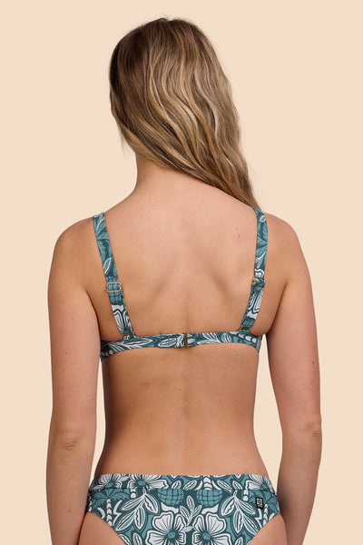 Female model wearing the Women's Nellie Bikini Top in the Shorebreak print, standing in front of a yellow background shown from the back view

|| Size S, Bust 33"  