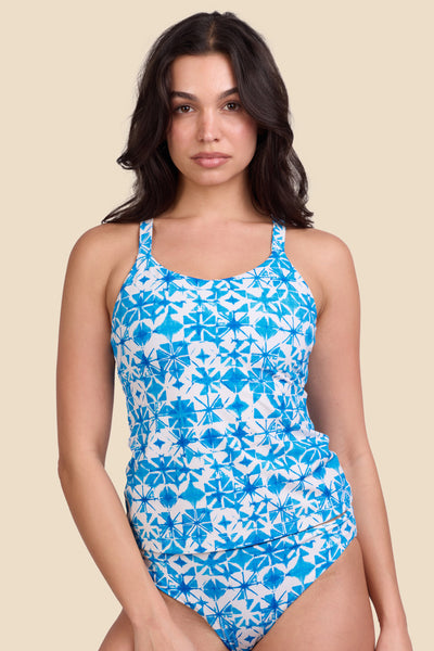 Female model wearing the Women's Paula Tankini Top in the Bluefin print, standing in front of a yellow background shown from the front view

|| Size M, Bust 32"  
