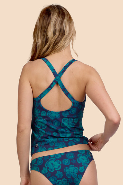 Female model wearing the Women's Paula Tankini Top in the Moon Flower, standing in front of a yellow background, shown from the back view

|| Size S, Bust 33"