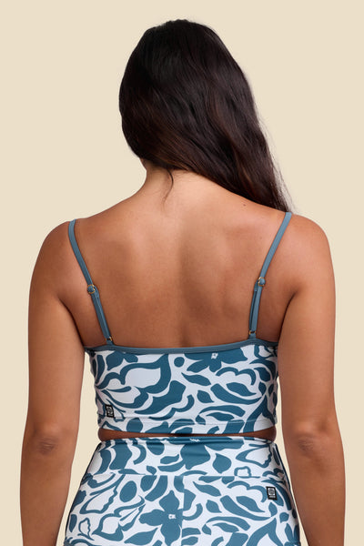 Female model wearing the Women's Wren Bikini Top in the Pua print, standing in front of a yellow background shown from the back view

|| Size S, Bust 34"  
