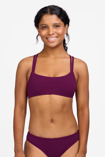 Female model wearing the Women's Fendrick Bikini Top in the Cabernet solid, standing in front of a grey background shown from the front view

|| Size S, Bust 32.5"