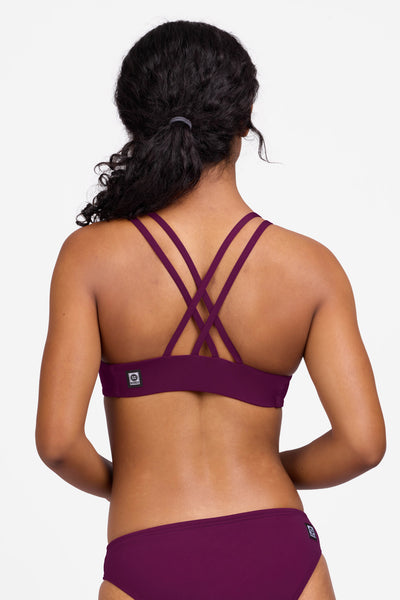 Female model wearing the Women's Fendrick Bikini Top in the Cabernet solid, standing in front of a grey background shown from the back view

|| Size S, Bust 32.5"