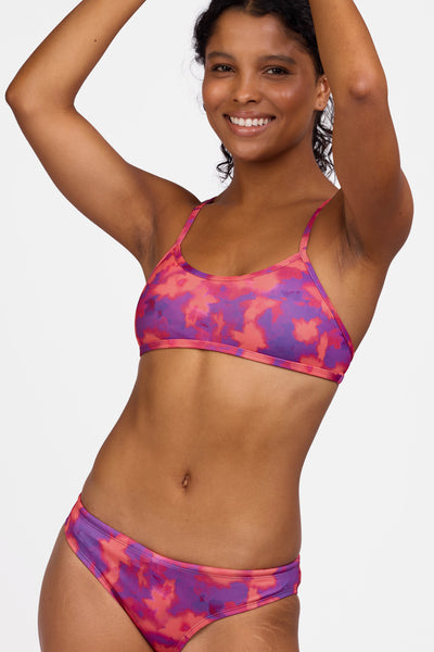 Female model wearing the Women's Jocelyn Bikini Top in the Canvas print, standing in front of a grey background shown from the front view

|| Size S, Bust 32.5"  