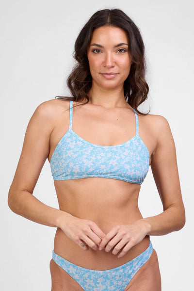 Female model wearing the Women's Jocelyn Bikini Top in the Gleam print, standing in front of a grey background shown from the front view

|| Size L, Bust 34"