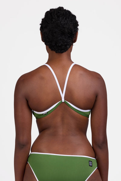 Male model wearing the Women's Jocelyn Bikini Top in the Mountain Mist contrast, standing in front of a grey background, shown from the back view

|| Size M, Bust 34"  