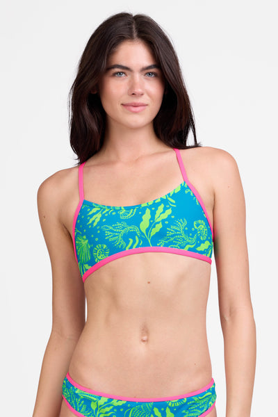 Female model wearing the Women's Jocelyn Bikini Top in the Undersea print, standing in front of a grey background shown from the front view

|| Size S, Bust 31"  