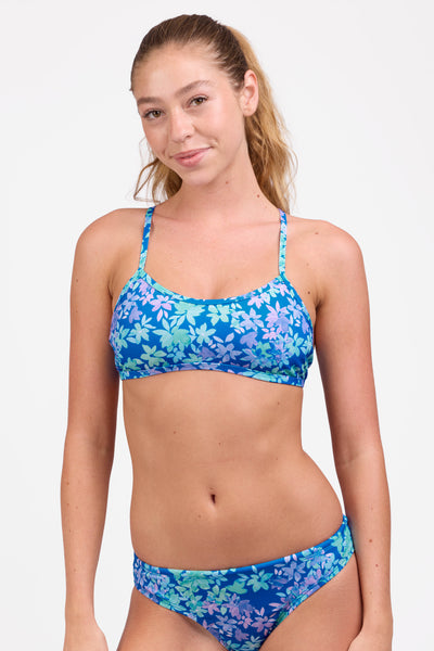 Female model wearing the Women's Jocelyn Bikini Top in the Waterlily print, standing in front of a grey background shown from the front view

|| Size M, Bust 33" 
