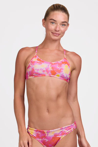 Female model wearing the Women's Natalie Bikini Top in the Sundae print, standing in front of a grey background shown from the front view

|| Size S, Bust 33"  