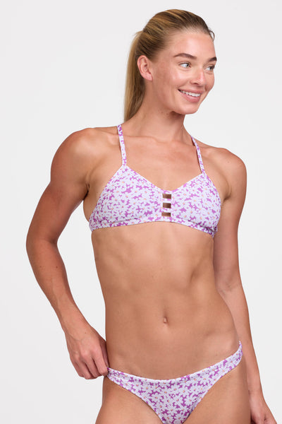 Female model wearing the Women's Tomcat Bikini Top in the Dovie print, standing in front of a grey background shown from the front view

|| Size S, Bust 33"  