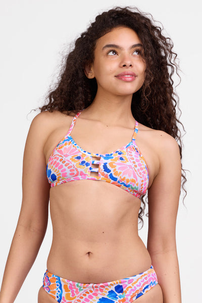 Female model wearing the Women's Tomcat Bikini Top in the Flutterfly print, standing in front of a grey background shown from the front view

|| Size L, Bust 32"
