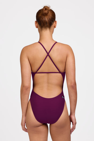Female model wearing the Women's Brandon One Piece Swimsuit in the Cabernet solid, standing in front of a grey background shown from the back view

|| Size 32, Torso 62.5"  