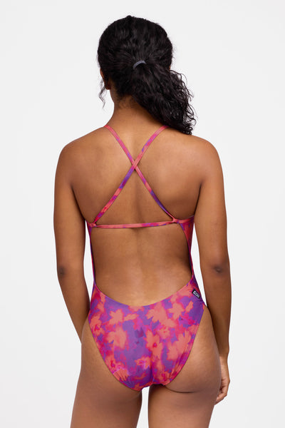 Female model wearing the Women's Brandon One Piece Swimsuit in the Canvas print, standing in front of a grey background shown from the back view

|| Size 30, Torso 59"  