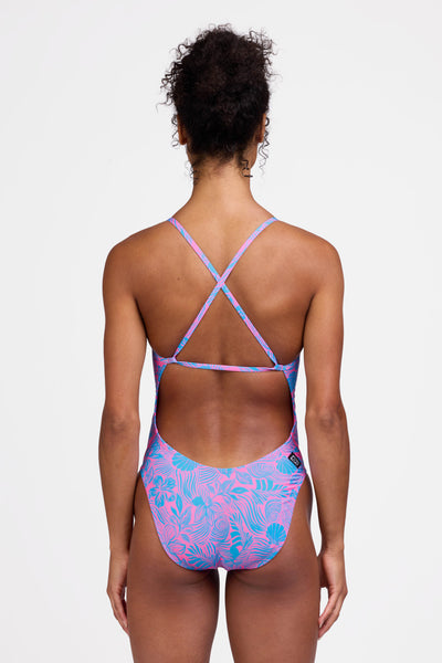Female model wearing the Women's Brandon One Piece Swimsuit in the Cruise print, standing in front of a grey background shown from the back view

|| Size 28, Torso 56"