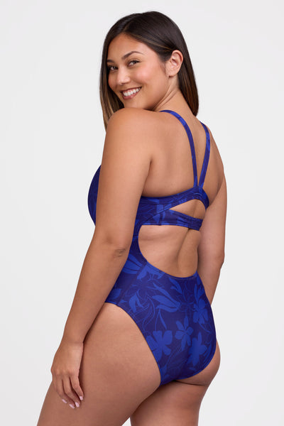 Female model wearing the Women's Caroline One Piece Swimsuit in the Waikiki print, standing in front of a grey background shown from the side view

|| Size 32, Torso 61.5"  