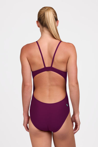 Female model wearing the Women's Devon One Piece Swimsuit in the Cabernet solid, standing in front of a grey background shown from the back view

|| Size 30, Torso 63" 