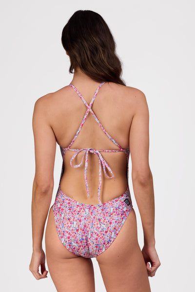 Female model wearing the Women's Jackson One Piece Swimsuit in the Hop Hop print, standing in front of a grey background shown from the back view

|| Size 30, Torso 62"  