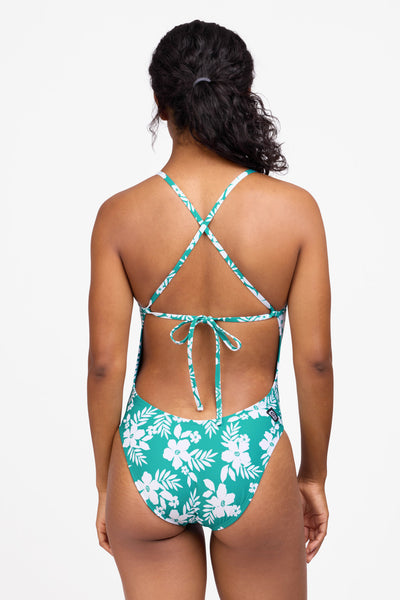 Female model wearing the Women's Jackson One Piece Swimsuit in the Tropical Island print, standing in front of a grey background shown from the back view

|| Size 30, Torso 59"  