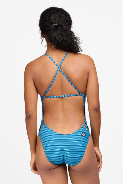 Female model wearing the Women's Julian One Piece Swimsuit in the Drift print, standing in front of a grey background shown from the back view 

|| Size 30, Torso 59"