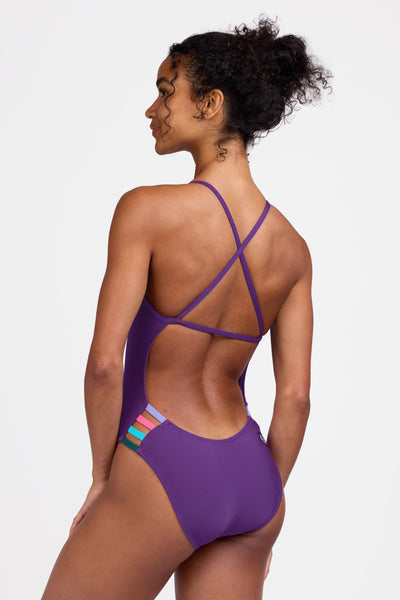 Female model wearing the Women's Julian One Piece Swimsuit in the Grape contrast, standing in front of a grey background shown from the side view

|| Size 28, Torso 56" 