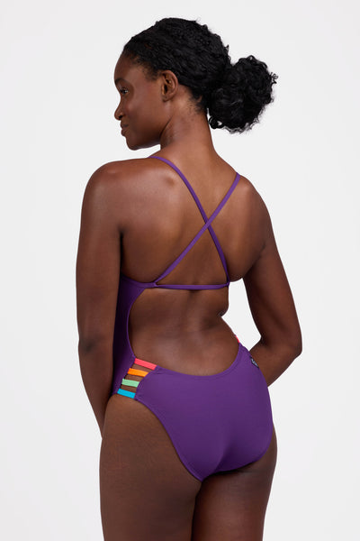 Female model wearing the Women's Gavin One Piece Swimsuit in the Grape contrast, standing in front of a grey background shown from the side view

|| Size 30, Torso 60.5"