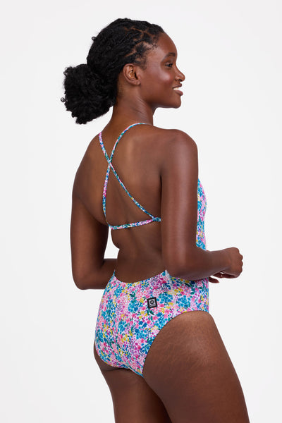 Female model wearing the Women's Marie One Piece Swimsuit in the Cherish print, standing in front of a grey background shown from the side view

|| Size 30, Torso 60.5"  