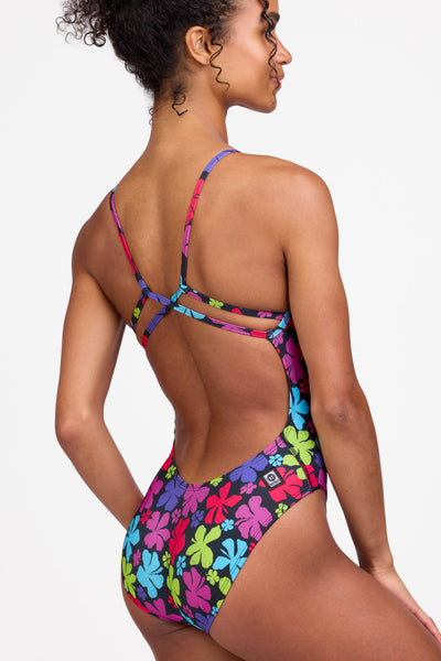 Female model wearing the Women's Michele One Piece Swimsuit in the Summernova print, standing in front of a grey background shown from the side view

|| Size 28, Torso 56"  
