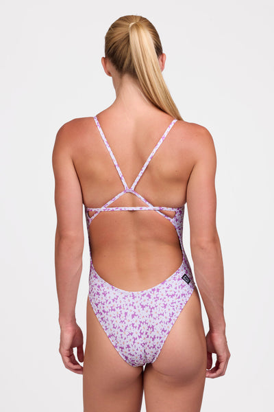 Female model wearing the Women's Perry One Piece Swimsuit in the Dovie print, standing in front of a grey background shown from the back view

|| Size 30, Torso 63"  