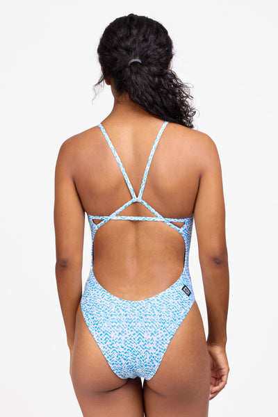 Female model wearing the Women's Perry One Piece Swimsuit in the Dreamweave print, standing in front of a grey background shown from the back view

|| Size 30, Torso 59"  