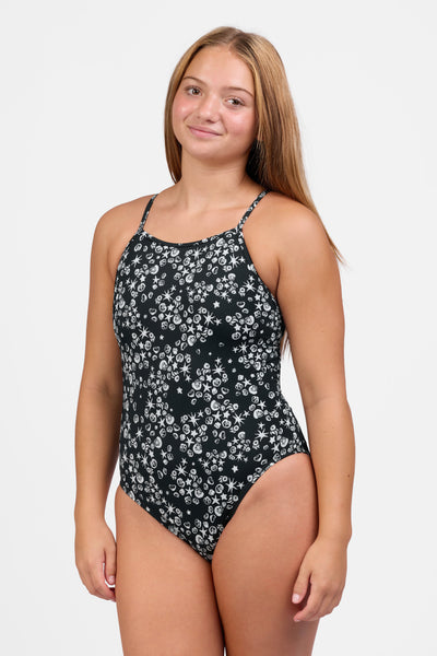 Female model wearing the Women's Tabitha One Piece Swimsuit in the Shells print, standing in front of a grey background shown from the front view