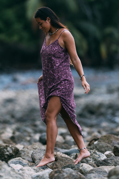 Female model wearing the Women's Lydia Dress in the Bondi Blossom print, standing in front of a green background shown from the side view

|| Size S, Height 5'4" 