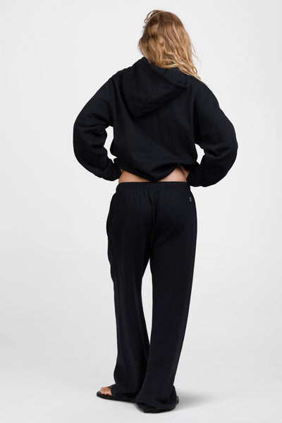 Female model wearing the Women's Nadia Sweat pant in the Black solid, standing in front of a grey background, shown from the back view

|| Size S, Hips 34.5"  