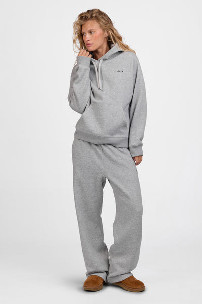Female model wearing the Women's Nadia Sweat pant in the Heather Grey solid, standing in front of a grey background, shown from the front view

|| Size S, Hips 34.5"  