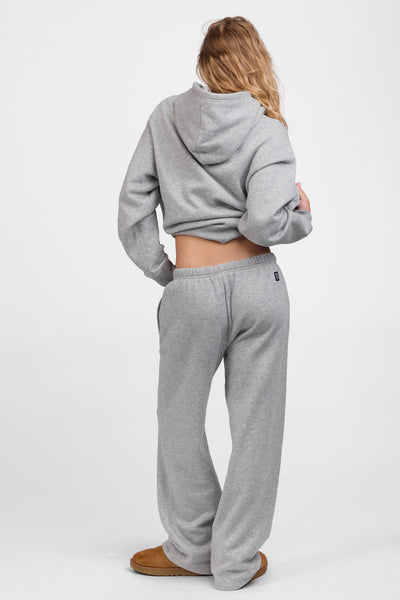 Female model wearing the Women's Nadia Sweat pant in the Heather Grey solid, standing in front of a grey background, shown from the back view

|| Size S, Hips 34.5"  